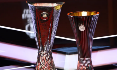 Troféus da Europa League e Conference League exibidos antes do sorteio da Uefa na temporada 2024/25